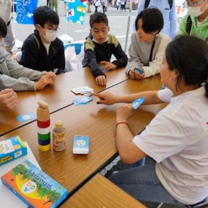 Children learning English by playing phonics cards