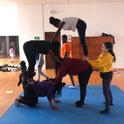 Teenagers practicing circus tricks